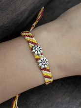 Load image into Gallery viewer, Sterling silver two oxidised flower on red,yellow and white pull-on thread rakhi - Odara Jewellery