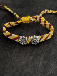 Sterling silver two oxidised flower on red,yellow and white pull-on thread rakhi - Odara Jewellery