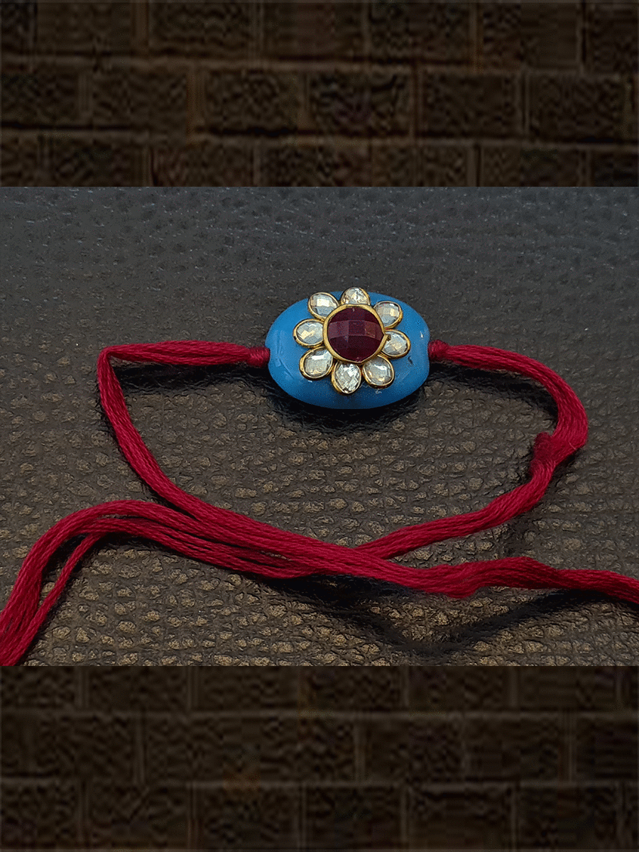 Ferozi oval bead with kundan flower with red colour thread rakhi - Odara Jewellery
