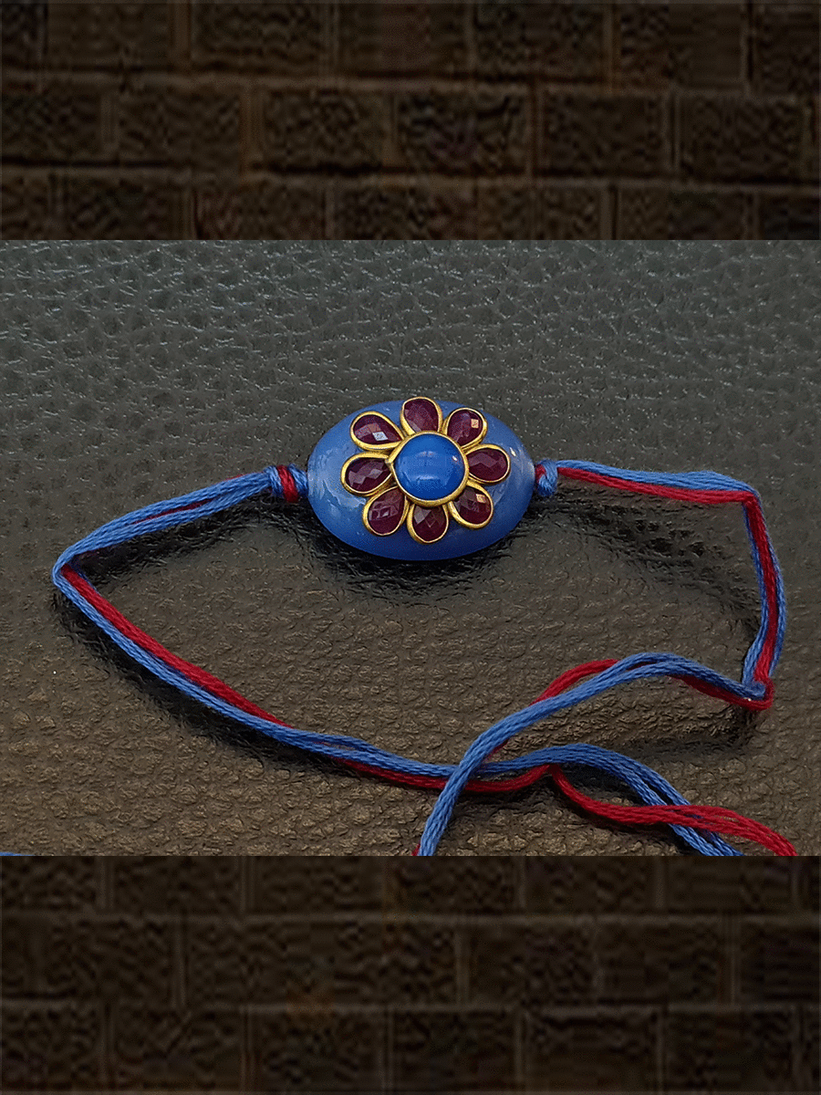 Blue oval bead with red stone flower with same colour thread rakhi - Odara Jewellery