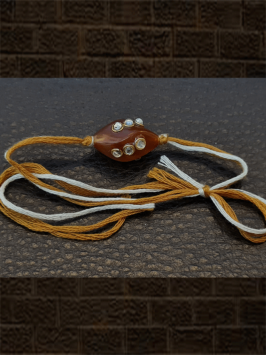 Brown bead kundan rakhi with brown and white thread - Odara Jewellery