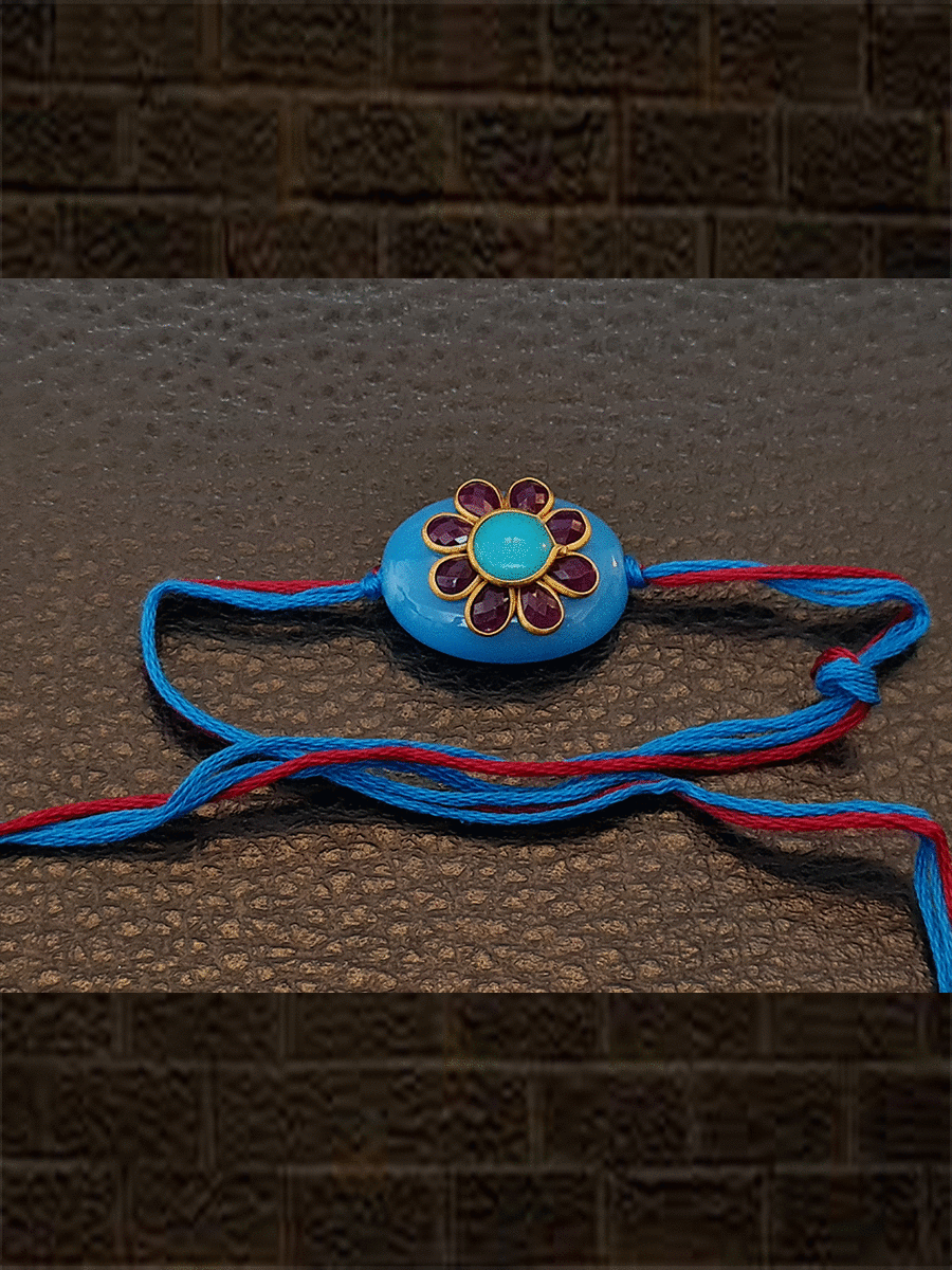 Ferozi oval bead with red stone flower with same colour thread rakhi - Odara Jewellery
