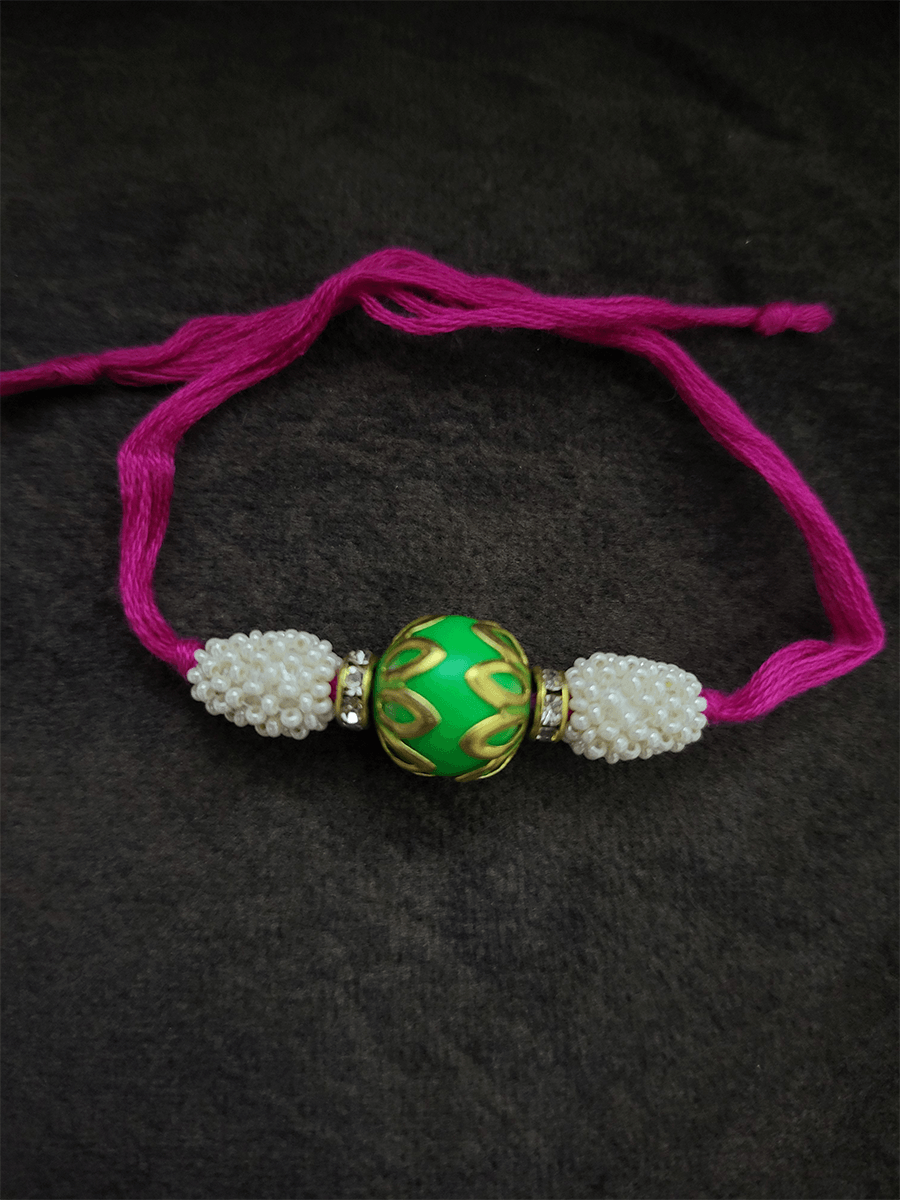 Lotus design on bead rakhi with fluorescent thread - Odara Jewellery