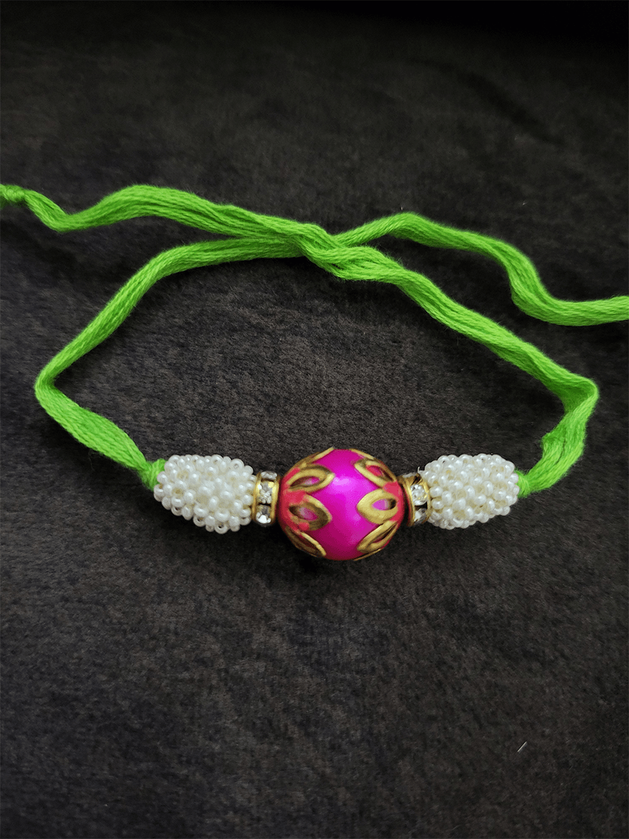 Lotus design on bead rakhi with fluorescent thread - Odara Jewellery