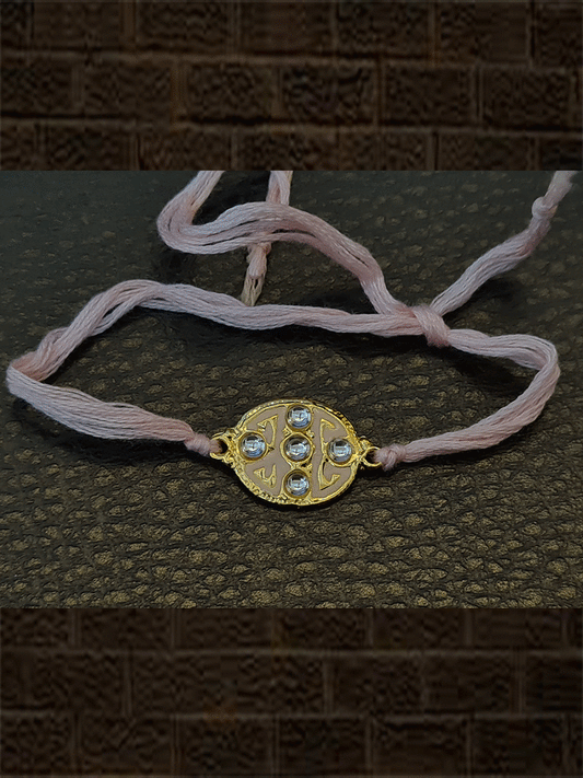 Oval pink enamel kundan stone rakhi with light pink thread - Odara Jewellery