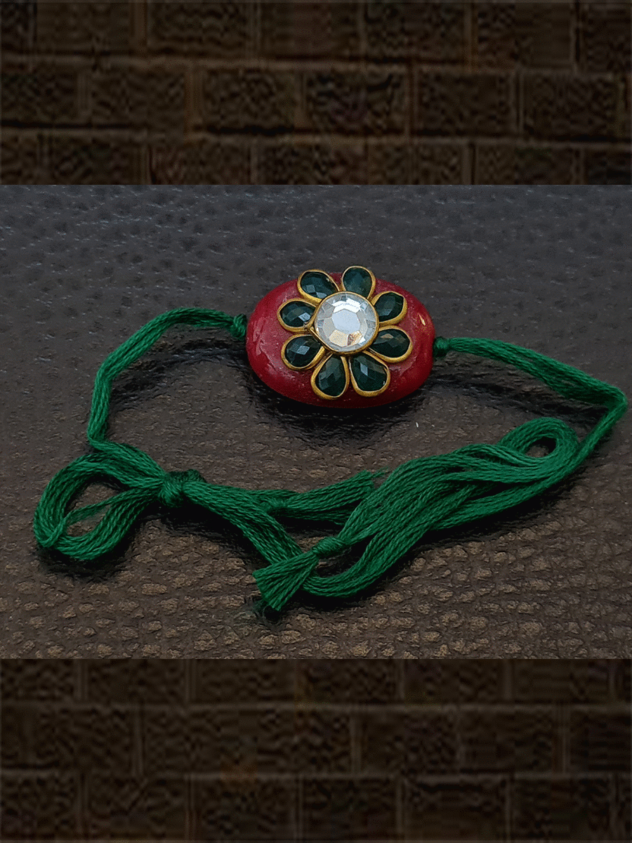 Red oval bead with green stone flower with green colour thread rakhi - Odara Jewellery