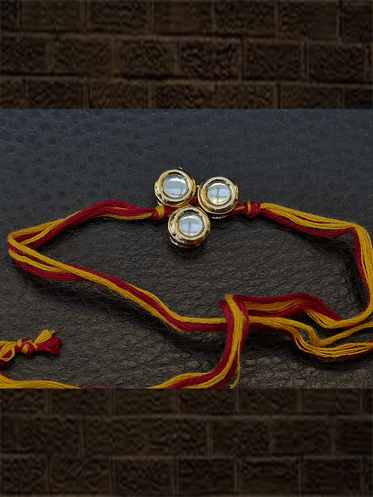 Round kundan rakhi in mauli thread - Odara Jewellery