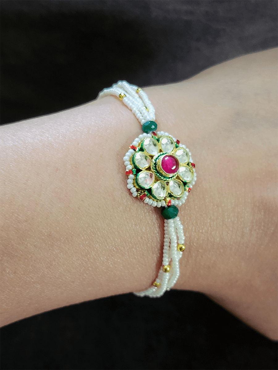 Pacchi kundan flower design bhabhi rakhi with ruby stone center - Odara Jewellery
