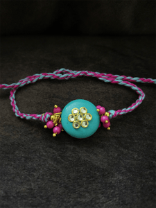 Ferozi round bead with kundan flower and pink bead cluster on both sides rakhi - Odara Jewellery