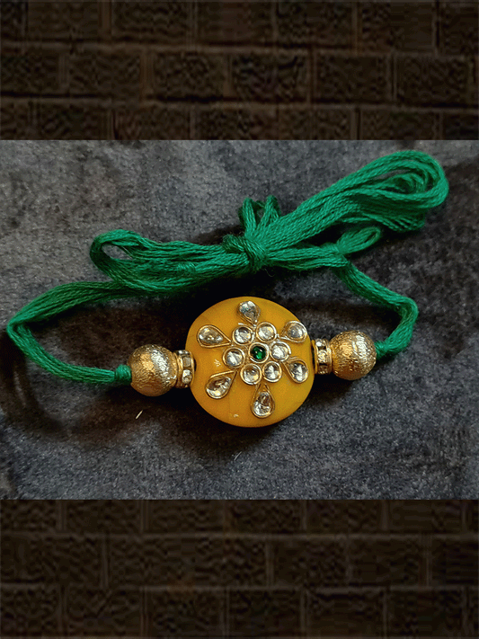 Yellow round bead kundan work with side gold beads rakhi - Odara Jewellery