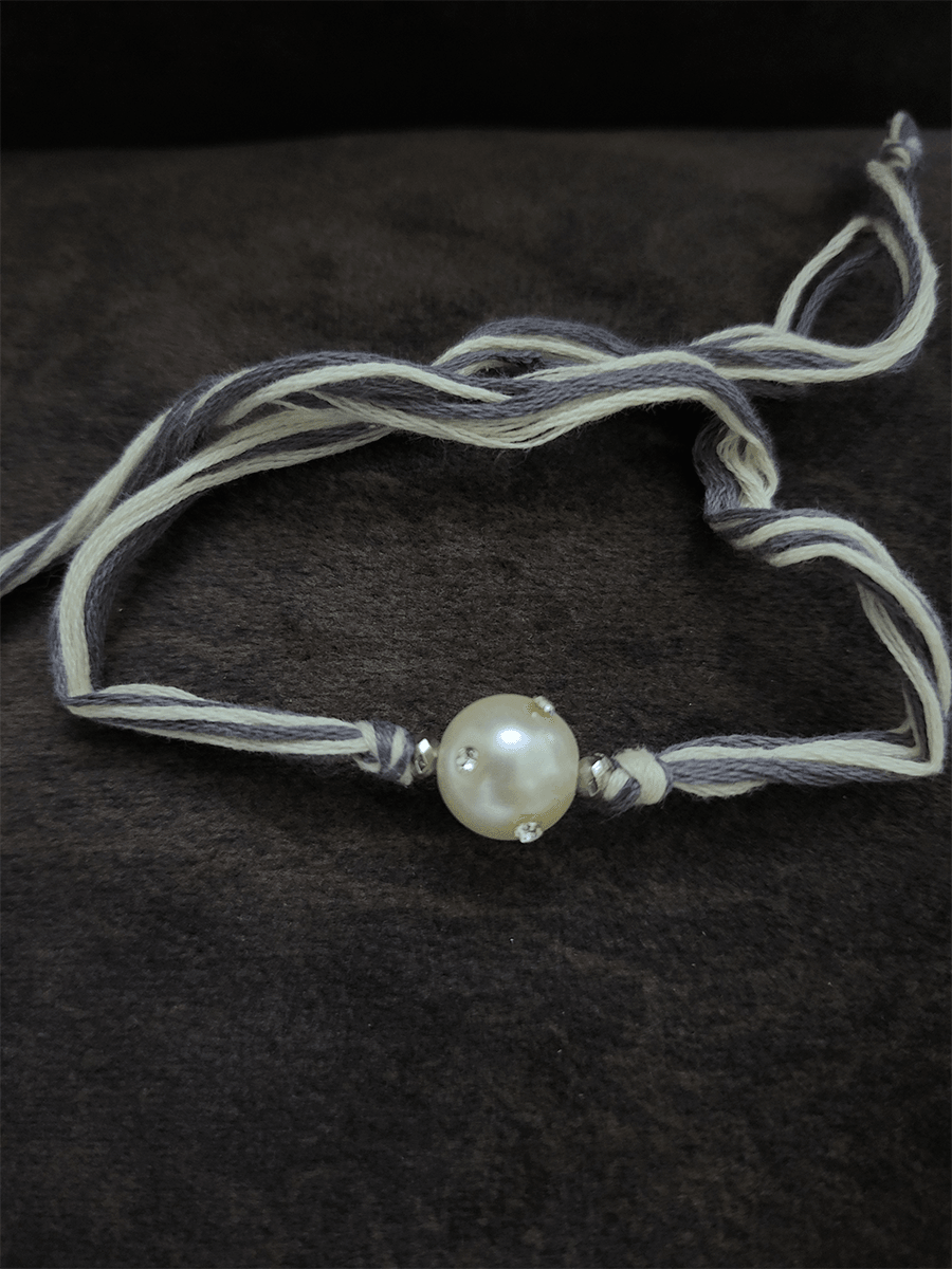 White stones embedded white bead grey thread rakhi - Odara Jewellery