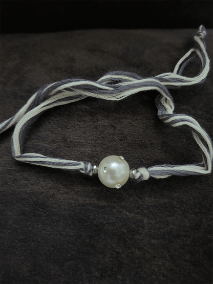 White stones embedded white bead grey thread rakhi - Odara Jewellery