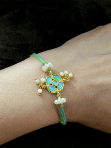 Stone studded flower shaped rakhi with pearly hangings - Odara Jewellery