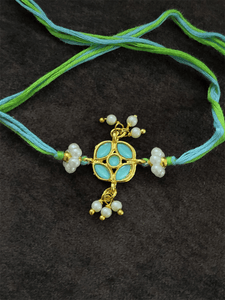 Stone studded flower shaped rakhi with pearly hangings - Odara Jewellery