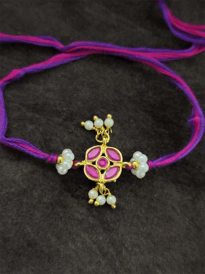 Stone studded flower shaped rakhi with pearly hangings - Odara Jewellery