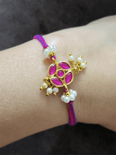 Load image into Gallery viewer, Stone studded flower shaped rakhi with pearly hangings - Odara Jewellery