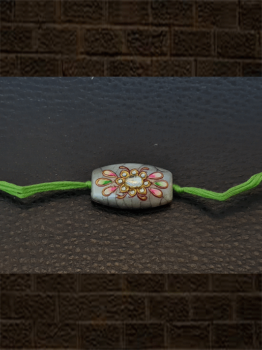 Round sides rectangular self design white bead kundan work hand painted rakhi - Odara Jewellery