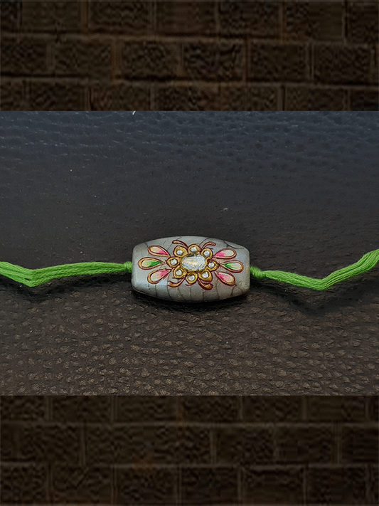 Round sides rectangular self design white bead kundan work hand painted rakhi - Odara Jewellery
