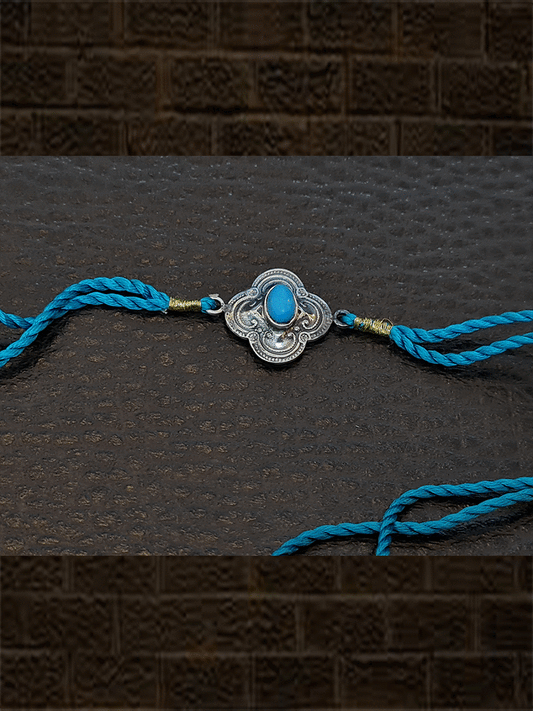 Ferozi thread sterling silver oxidised flower design rakhi with turquoise cultured cabusion - Odara Jewellery