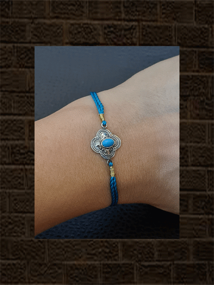 Ferozi thread sterling silver oxidised flower design rakhi with turquoise cultured cabusion - Odara Jewellery