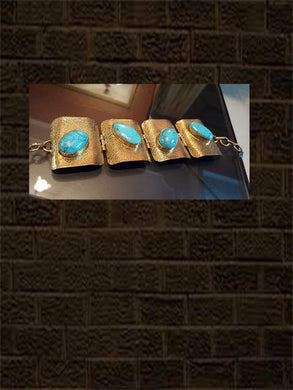Broad rectangular brass bracelet with turquoise stone