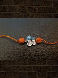 Sterling silver flower rakhi with orange thread - Odara Jewellery