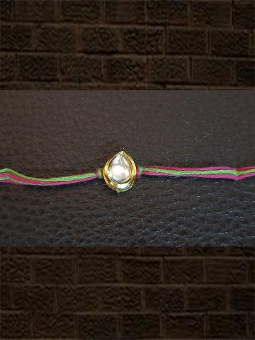 Kundan rakhi in rani and green thread - Odara Jewellery